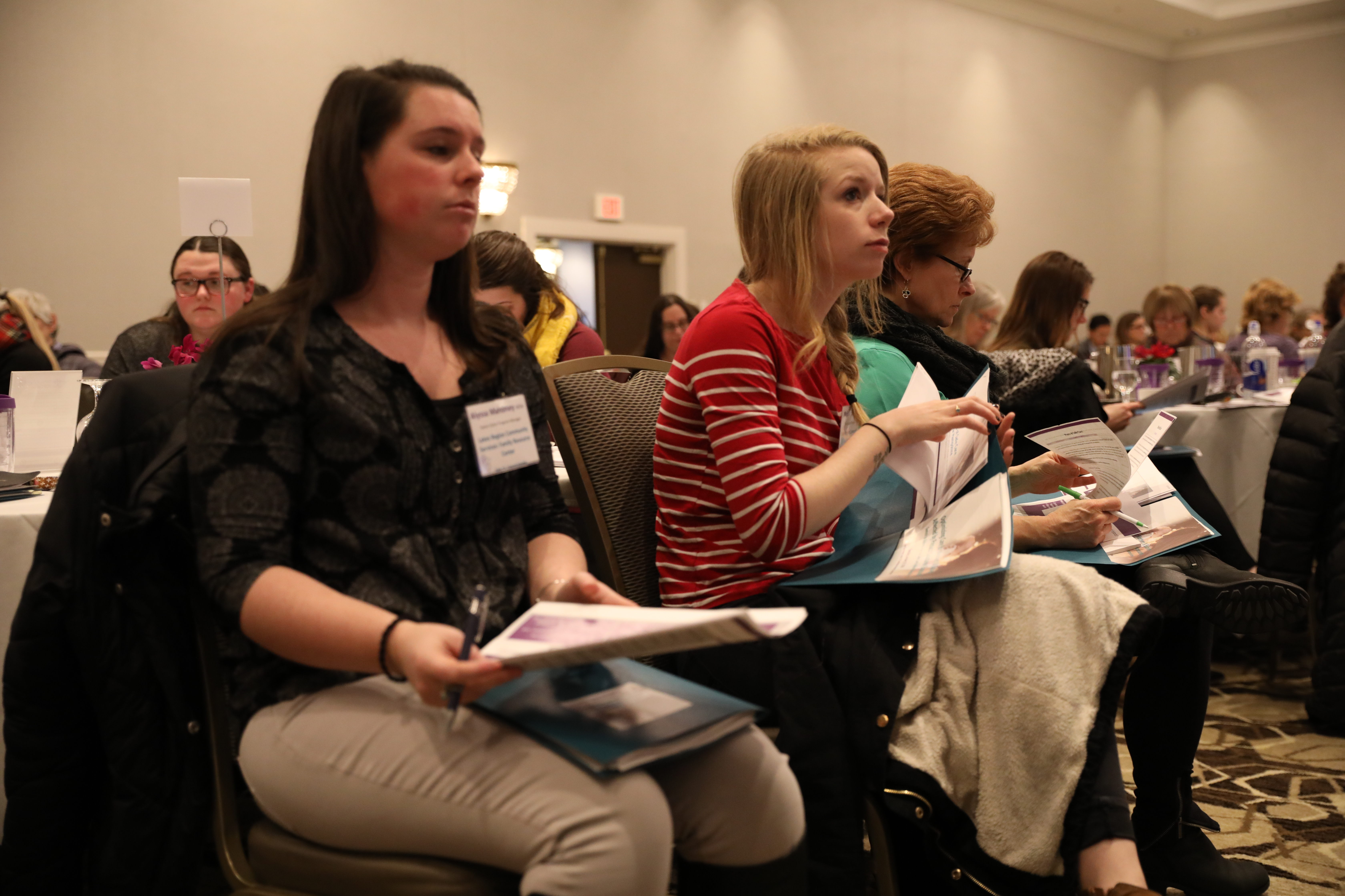 POSC Summit attendees listening to a presentation